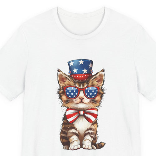 Close-up of the Patriotic Kitty print: tabby kitten in a stars-and-stripes top hat, flag sunglasses, and striped bow tie, on the White tee
